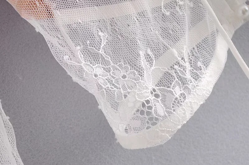 Contemporary Loose-Fit Plunge Rear Keyhole Wrist-Length Puff Top
