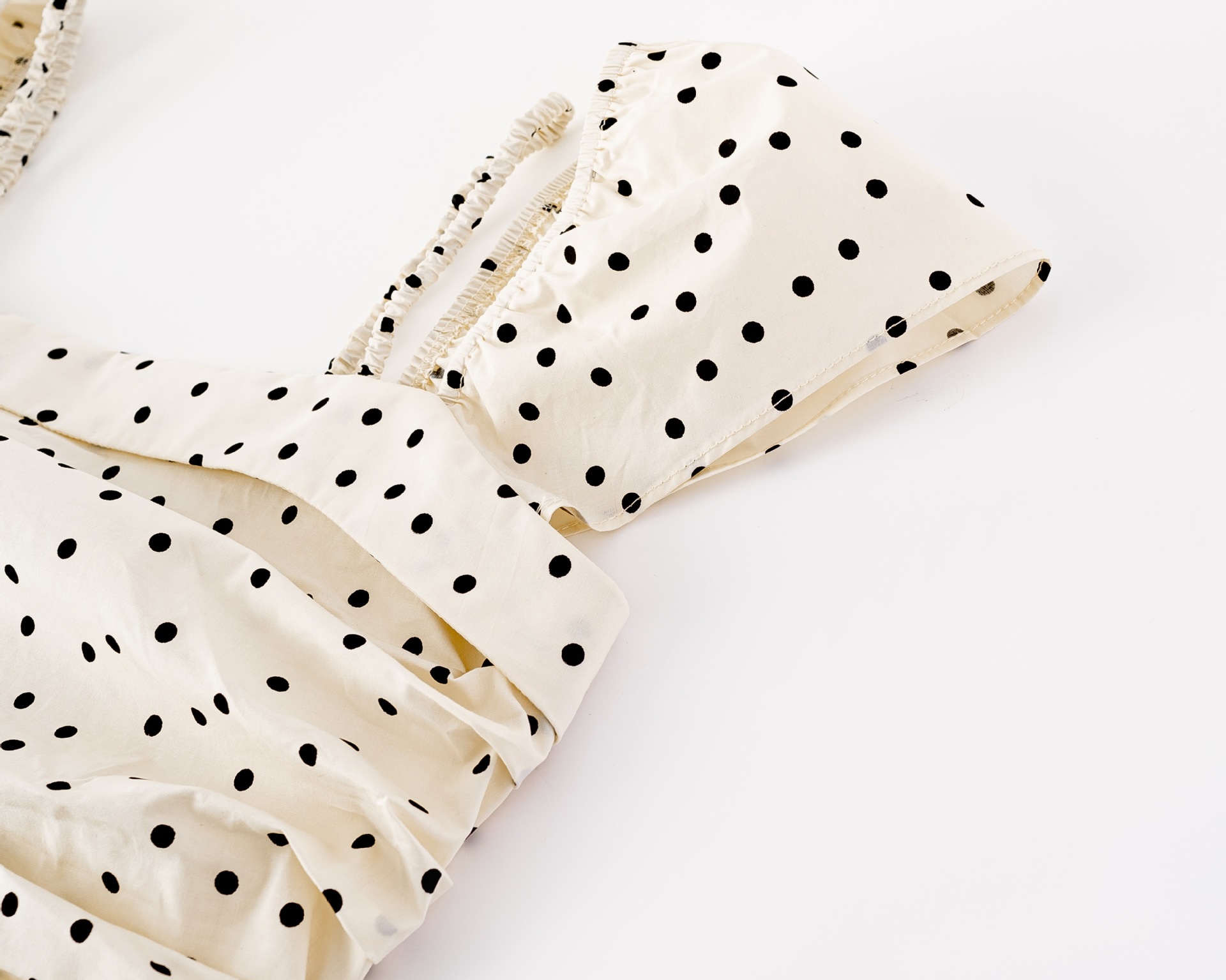 Polka dot pleated waist cinching dress