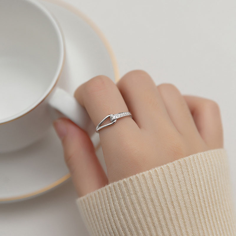 Approximately long diamond hollow titanium steel ring, female niche design, light luxury, fashionable and personalized ring