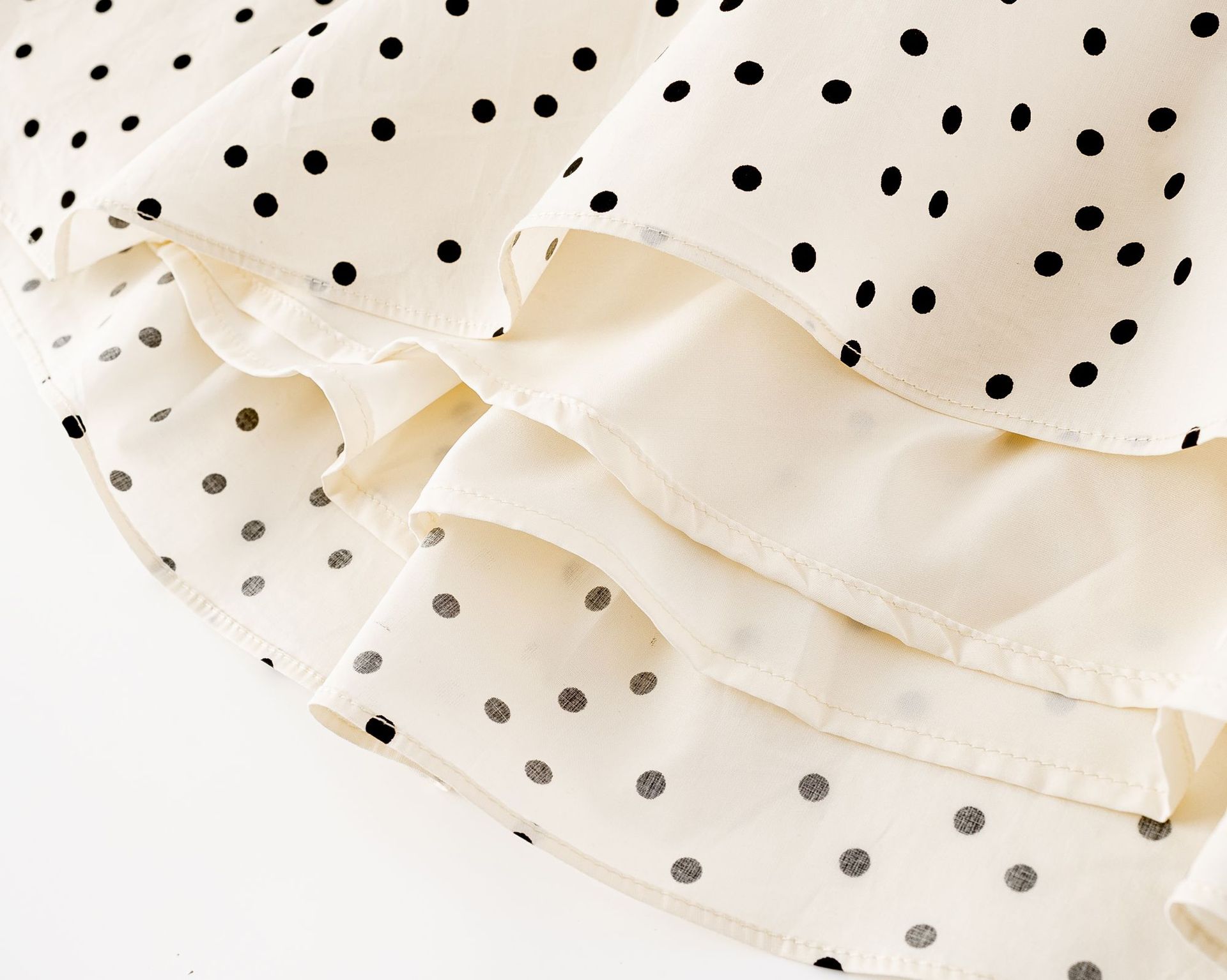 Polka dot pleated waist cinching dress