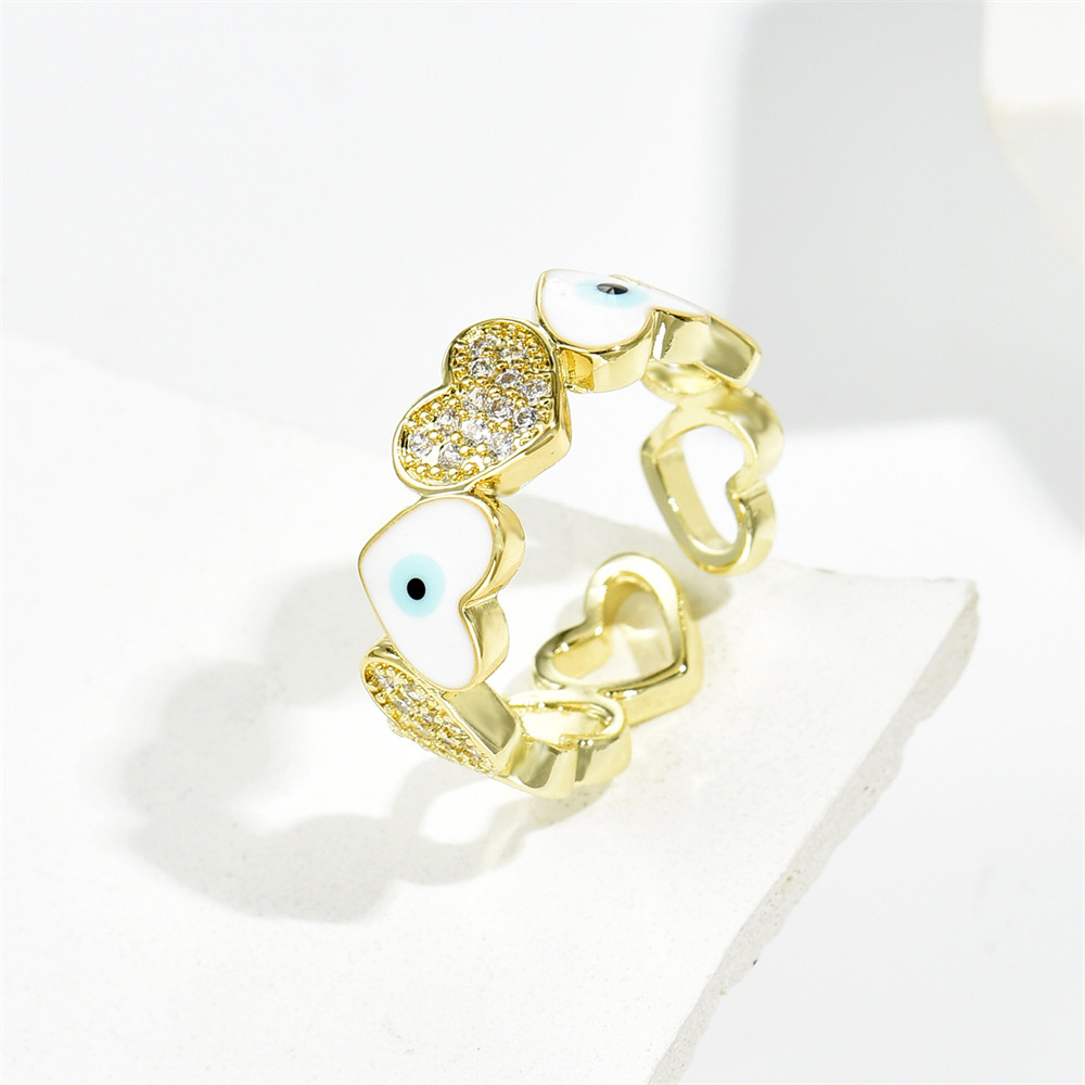 Hot selling new love oil drop zircon in Europe and America, devil's eye gold open ring for women