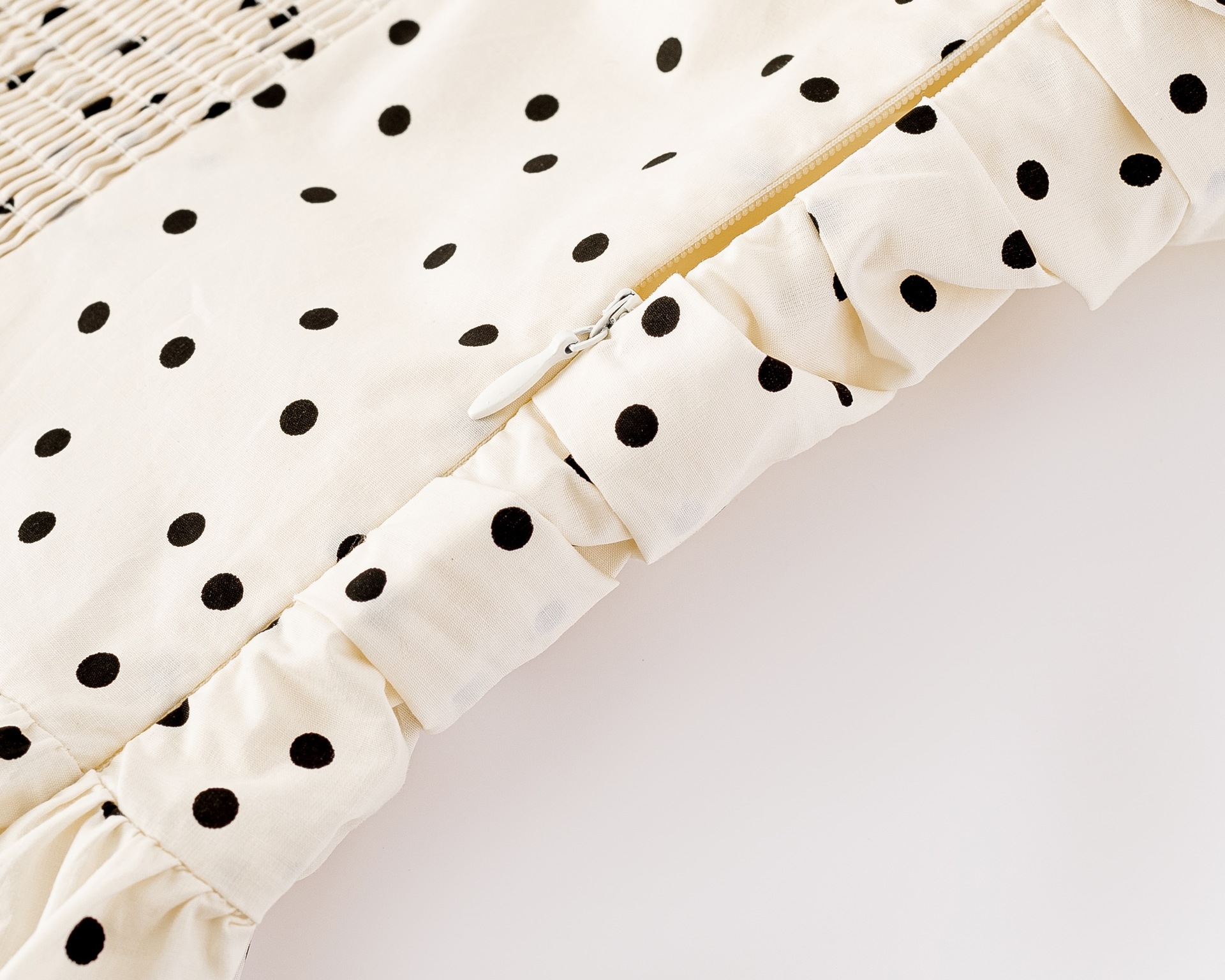 Polka dot pleated waist cinching dress