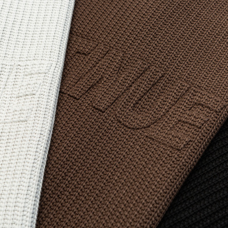 Solid color letter embossed round neck loose knit sweater