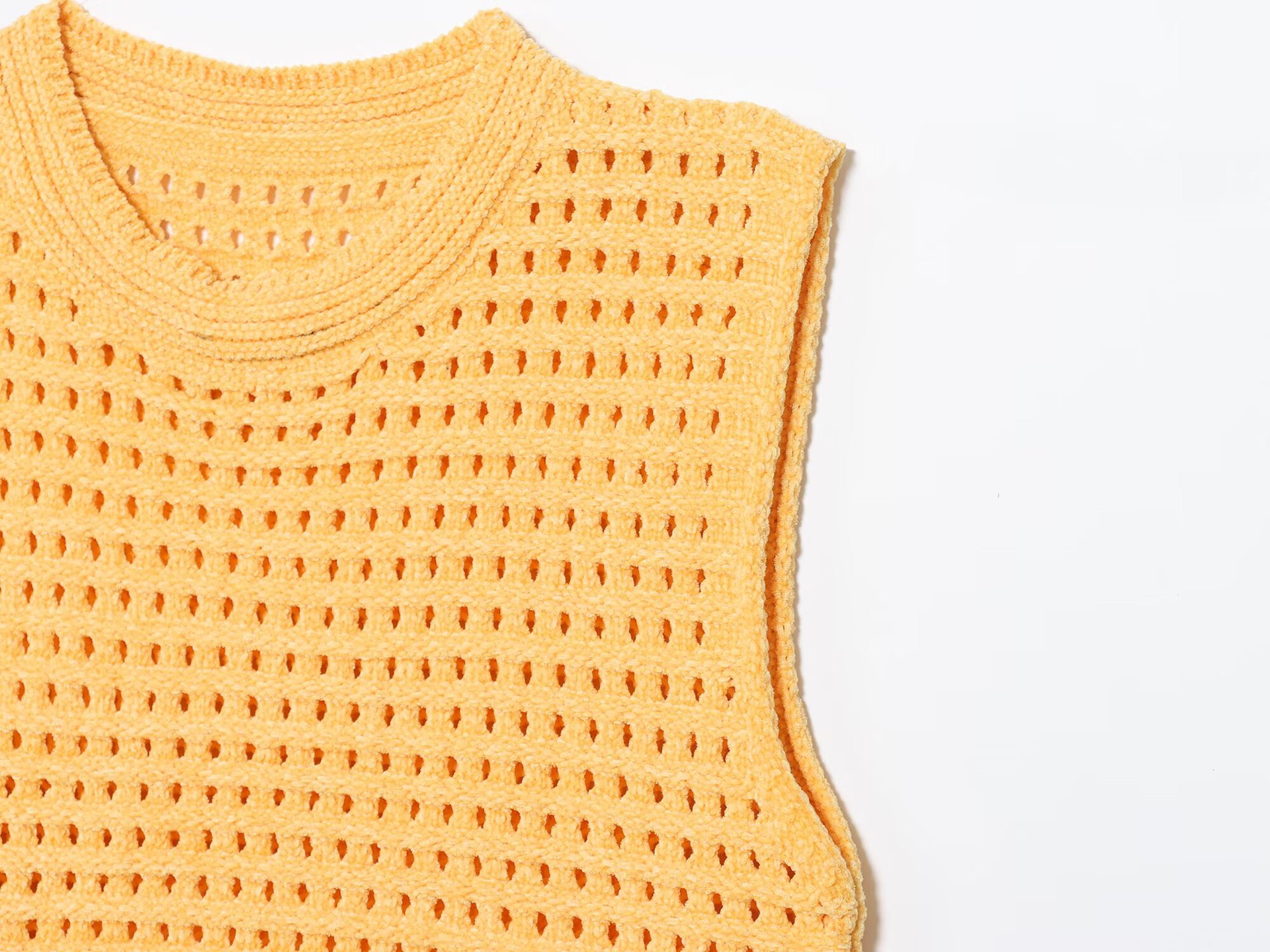 Round neck sleeveless tassel embellished hollow grid knit sweater for women