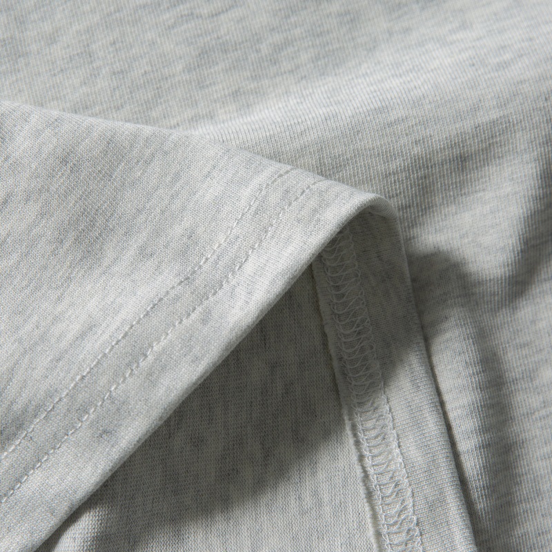 Loose shoulder length short sleeves with wrapped edge and patch pocket design
