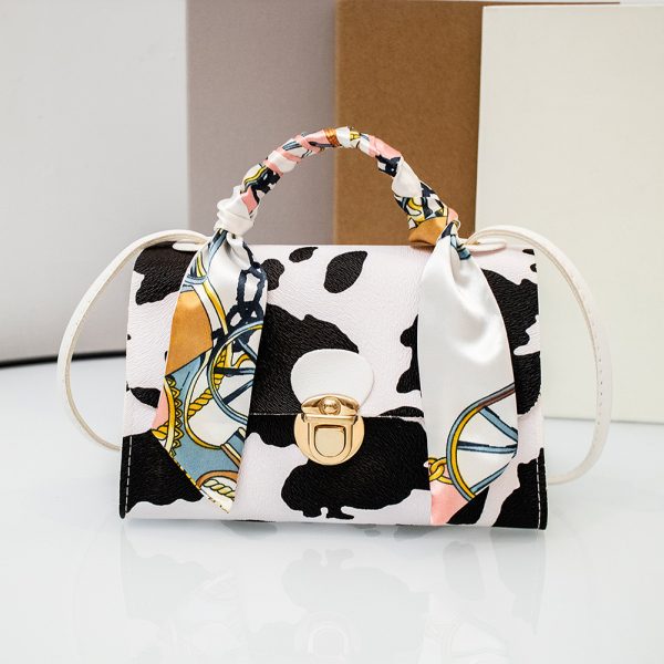 White Cow Pattern Ribbon Decor PU Leather Bag